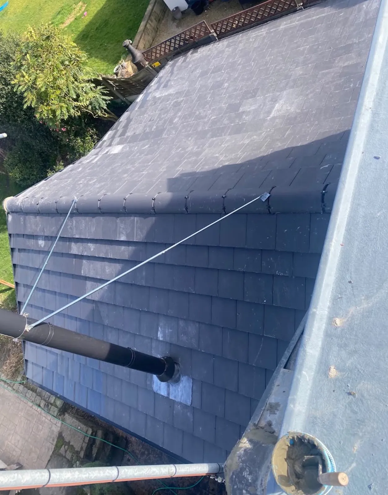 New slate roof with a vent pipe
