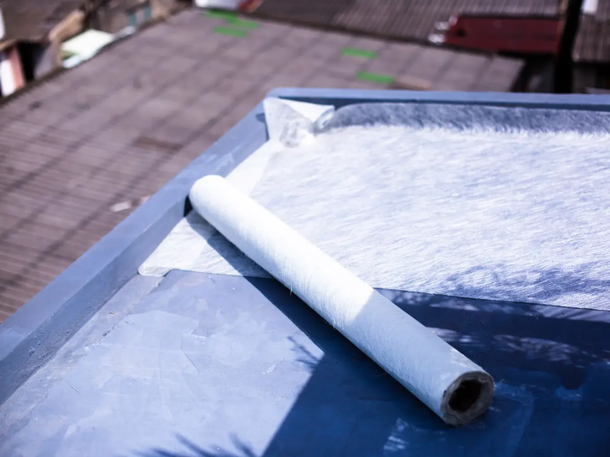 Fibreglass matting laid on a flat roof deck